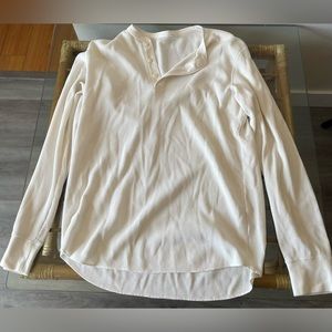 Large off-white long-sleeve waffle T-shirt with buttons.